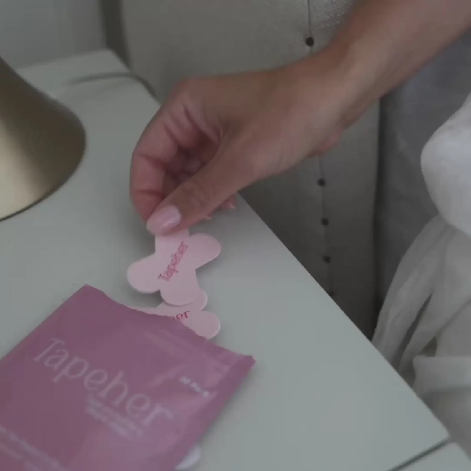 TapeHer X-shaped mouth tape on lips close-up