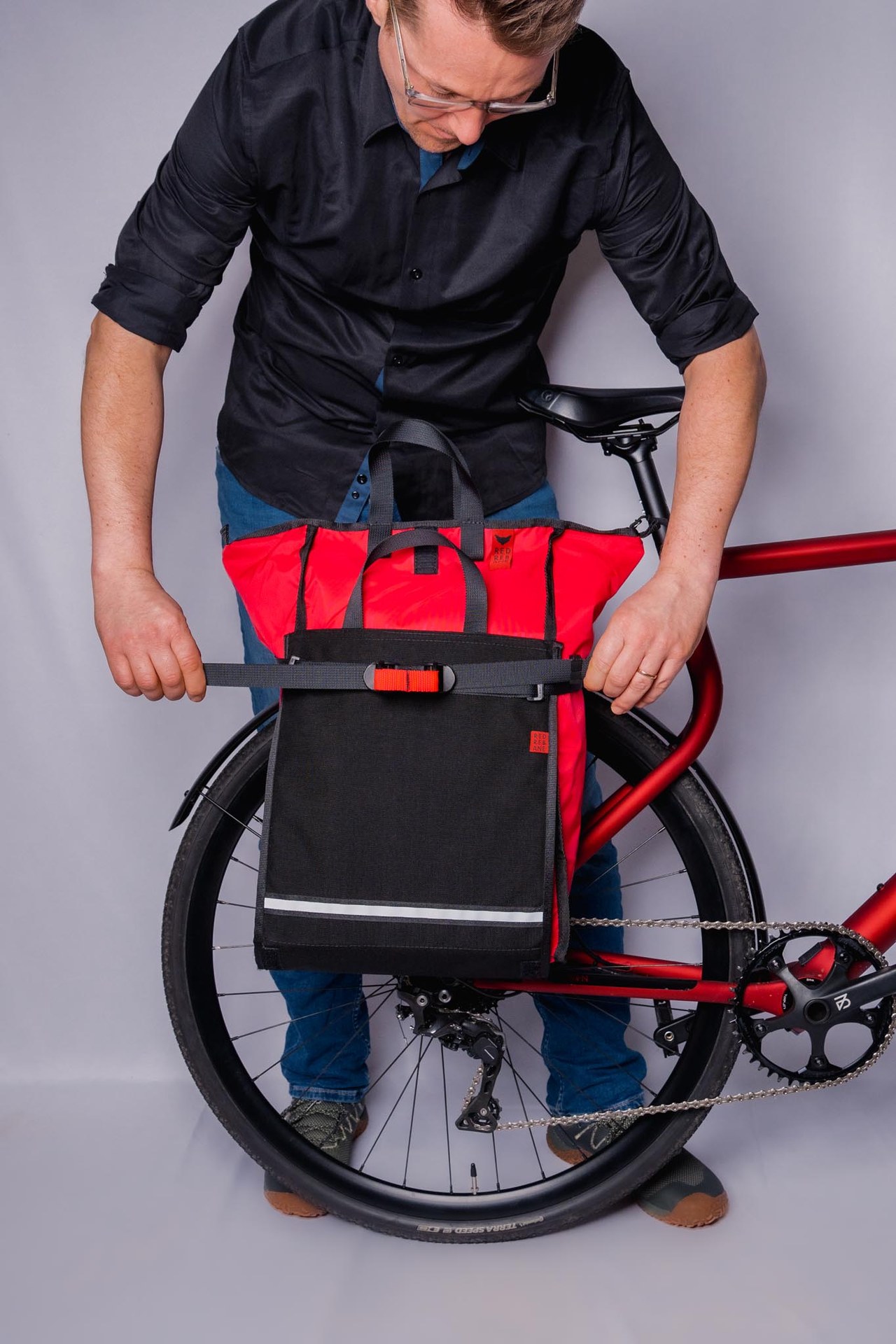 Red Rebane Easy EXO mounted on a bike rear rack