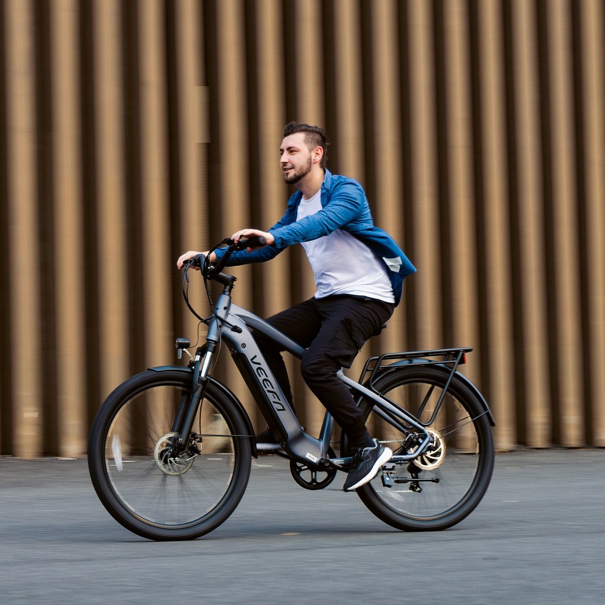 Rider on a Veefa city electric bike on an urban street