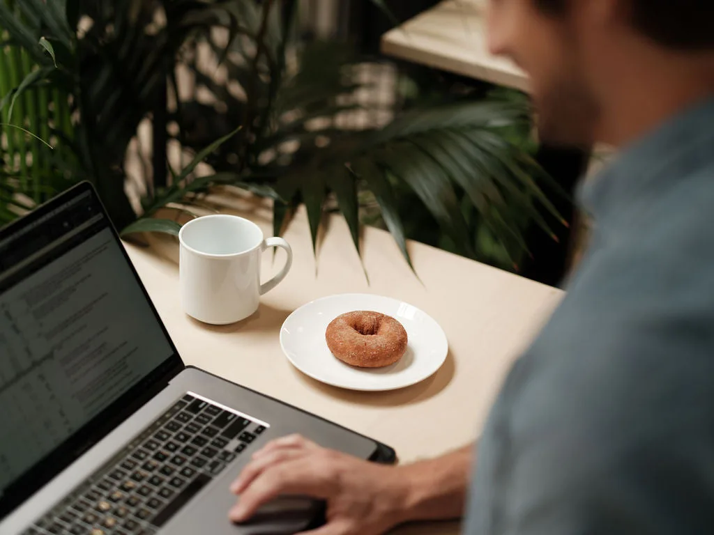 Freshly baked Prodough protein donuts showing soft, moist texture and glaze