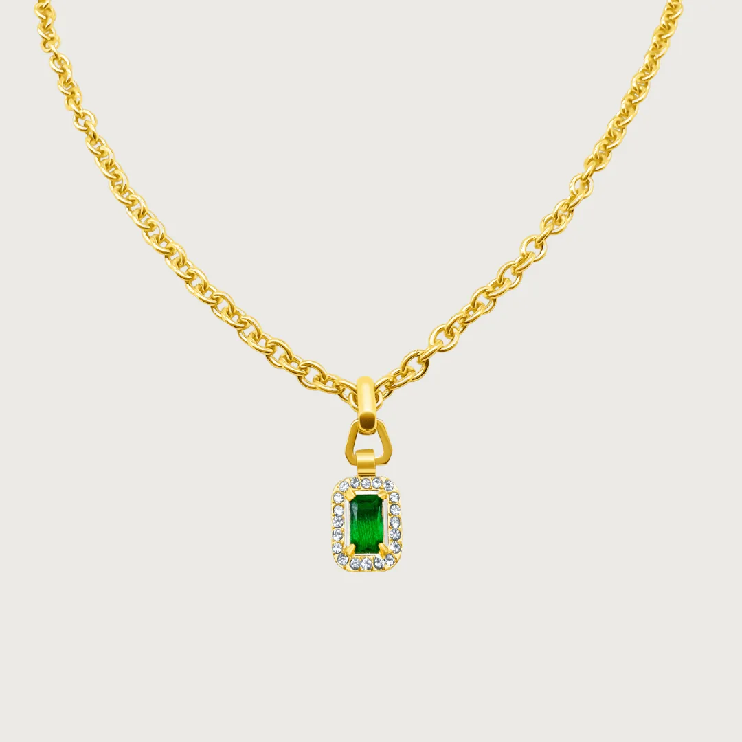 Close-up of a red cubic zirconia stone in a Raena Stones gold-plated setting