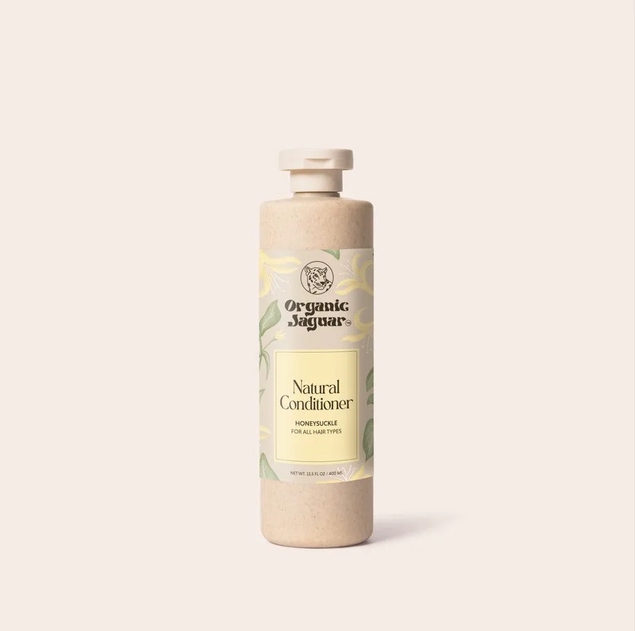Applying Organic Jaguar Natural Conditioner to hair ends in the shower
