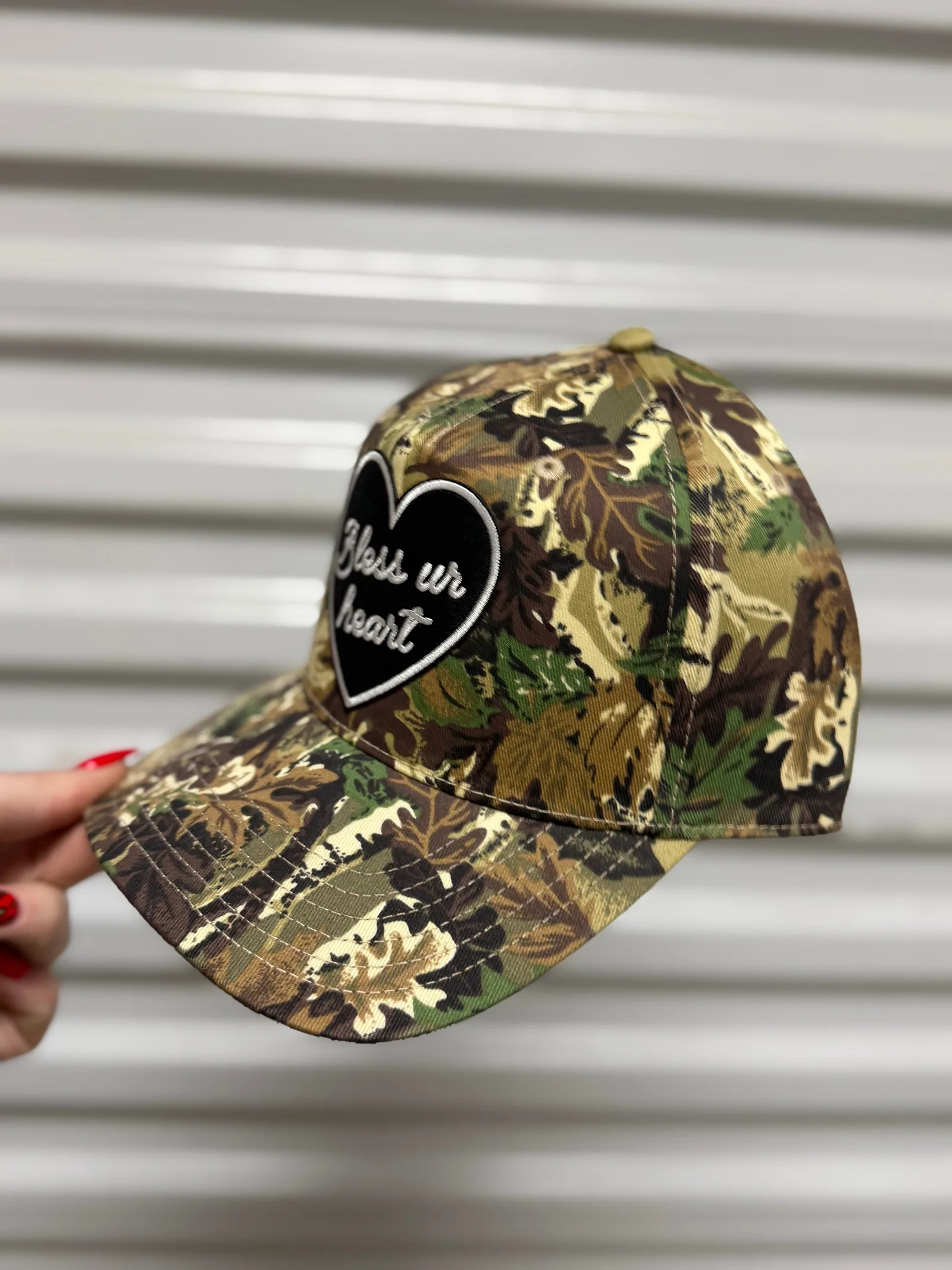 Bless Your Heart camo trucker hat stocked at Dani Morgans Boutique