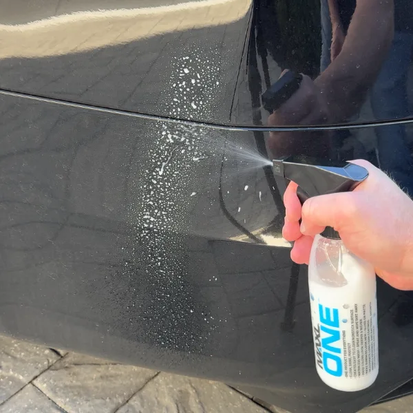 Applying MAXL ONE Triphene spray coating and buffing with a microfiber towel