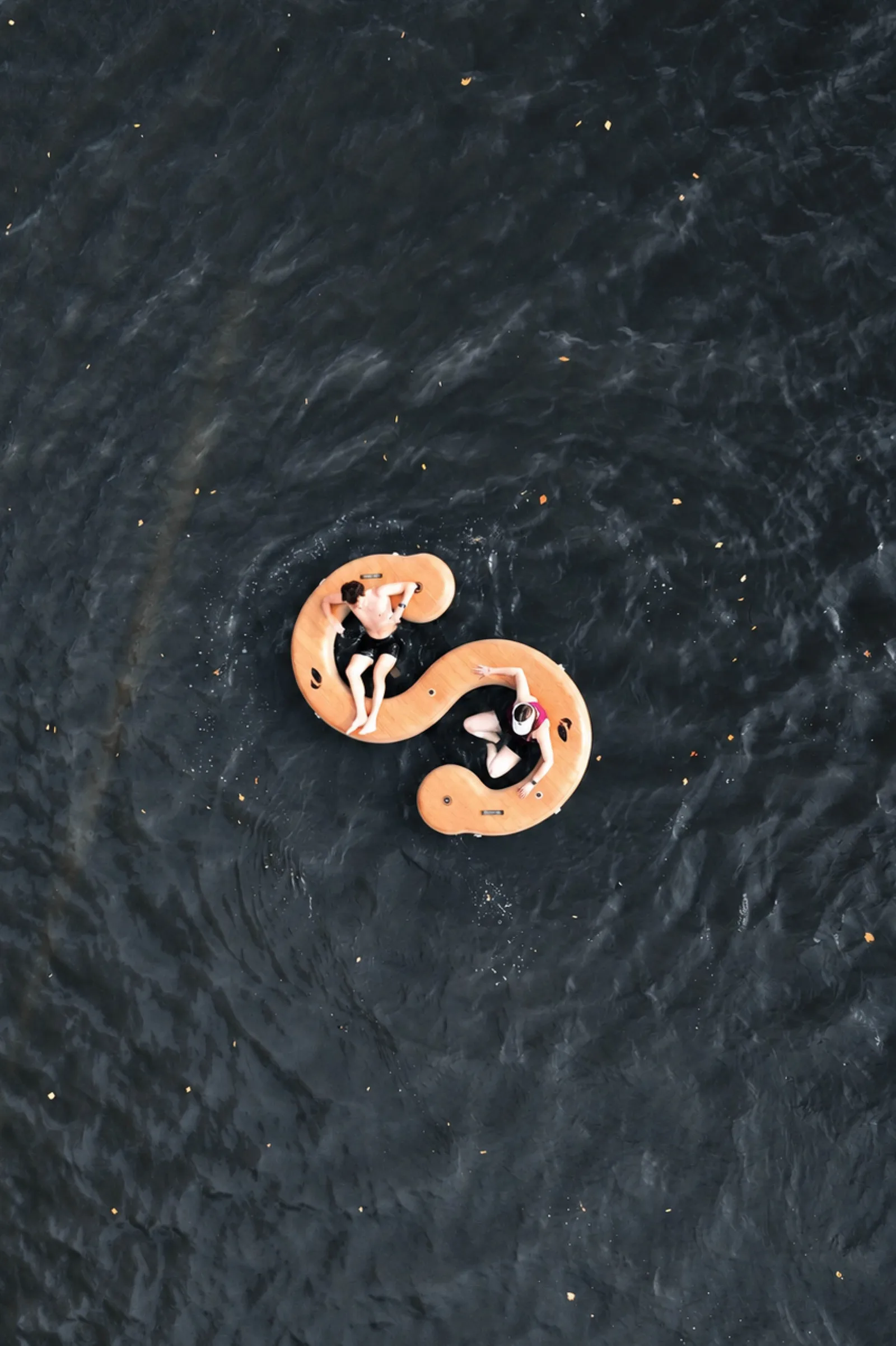 Paddle North Lake Snake inflatable lake float with people lounging