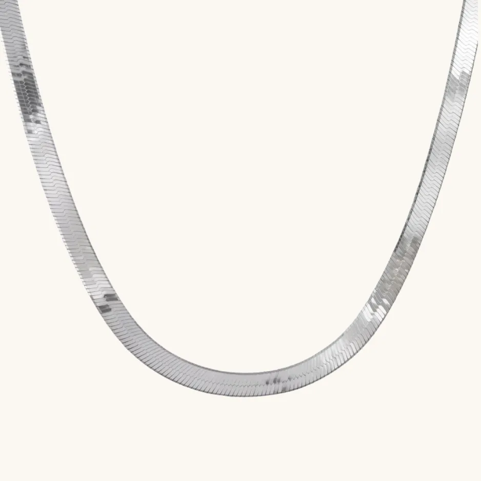 Gold-plated jewelry base metal comparison showing a stainless steel chain link