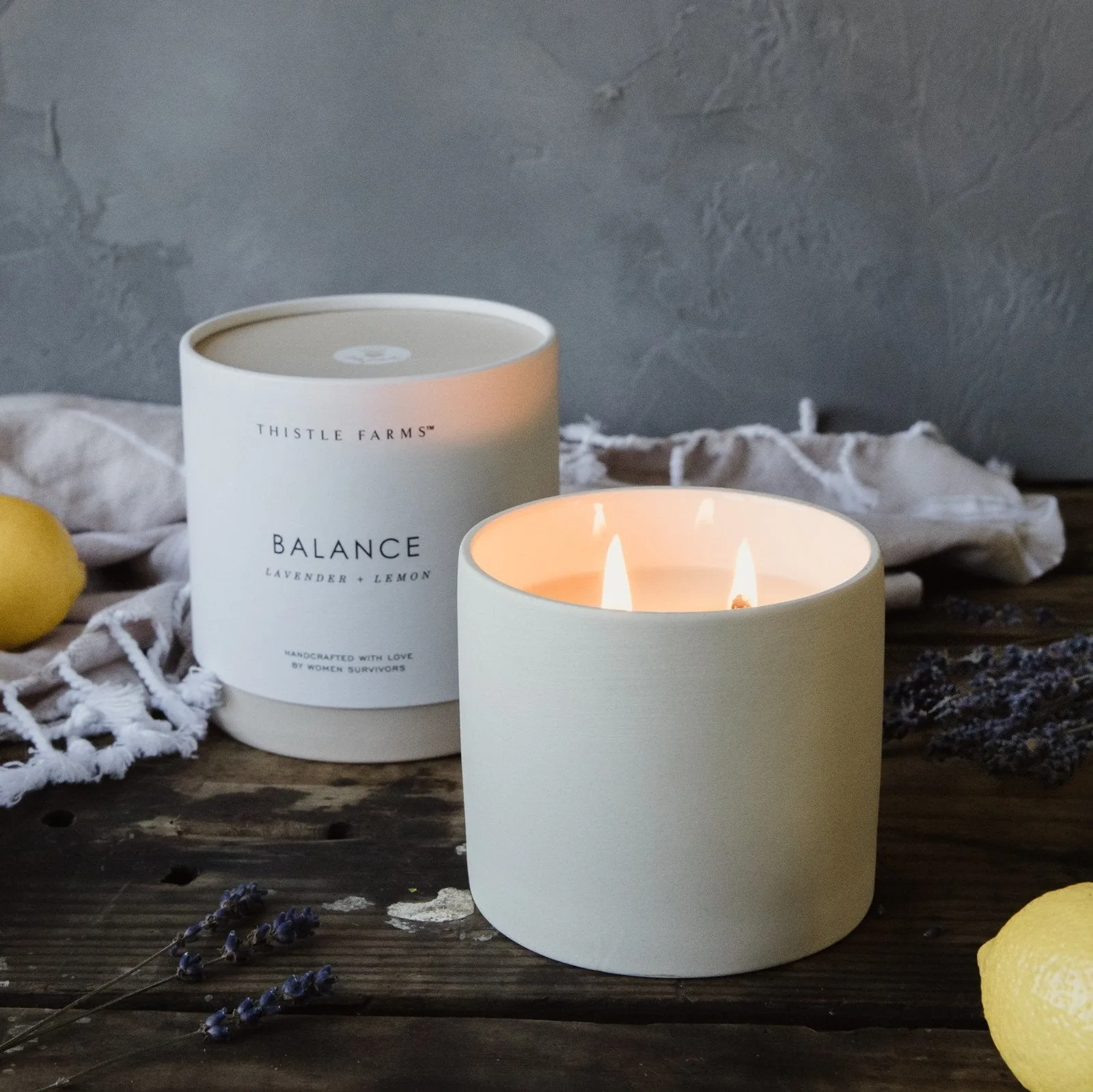 Thistle Farms Balance candle jar with lavender lemon rose geranium label detail